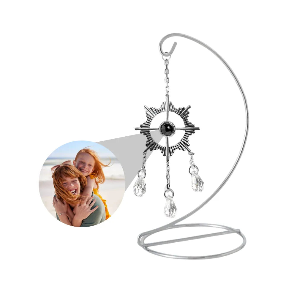 Custom photo sun catcher in a sun shape that can be customized with photo, is hanging on a tabletop stand