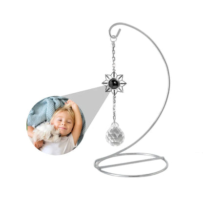 Decorative hanging sun catcher that can be customized with photo is hanging on a tabletop stand