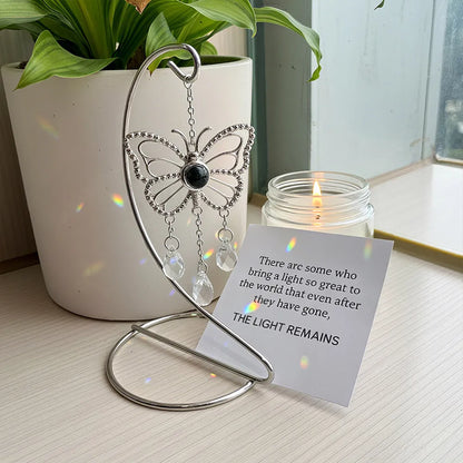 Butterfly-shaped custom photo suncatcher with a photo pendant and teardrop crystals. Sentimental gift set with sympathy card.