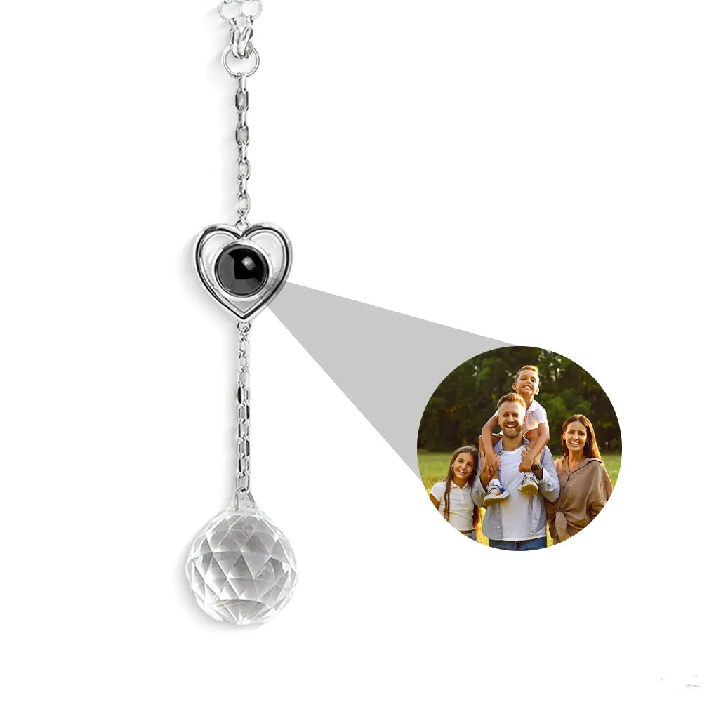 Heart-shaped photo suncatcher with a family photo projected onto it