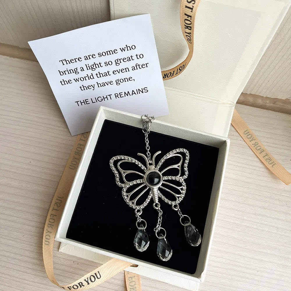 Butterfly-shaped custom photo suncatcher with a photo pendant and teardrop crystals. Sentimental gift set with sympathy card. 