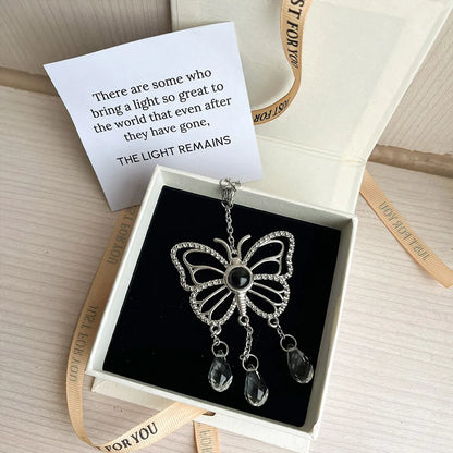 Butterfly-shaped custom photo suncatcher with a photo pendant and teardrop crystals. Sentimental gift set with sympathy card. 
