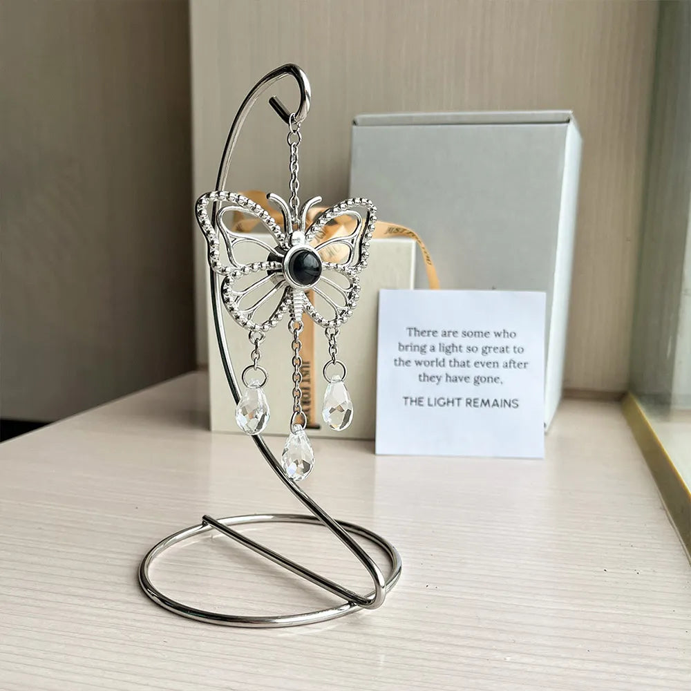 Butterfly-shaped custom photo suncatcher with a photo pendant and teardrop crystals. Sentimental gift set with sympathy card. Tabletop stand with suncatcher.